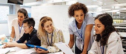 Professor with students in lab